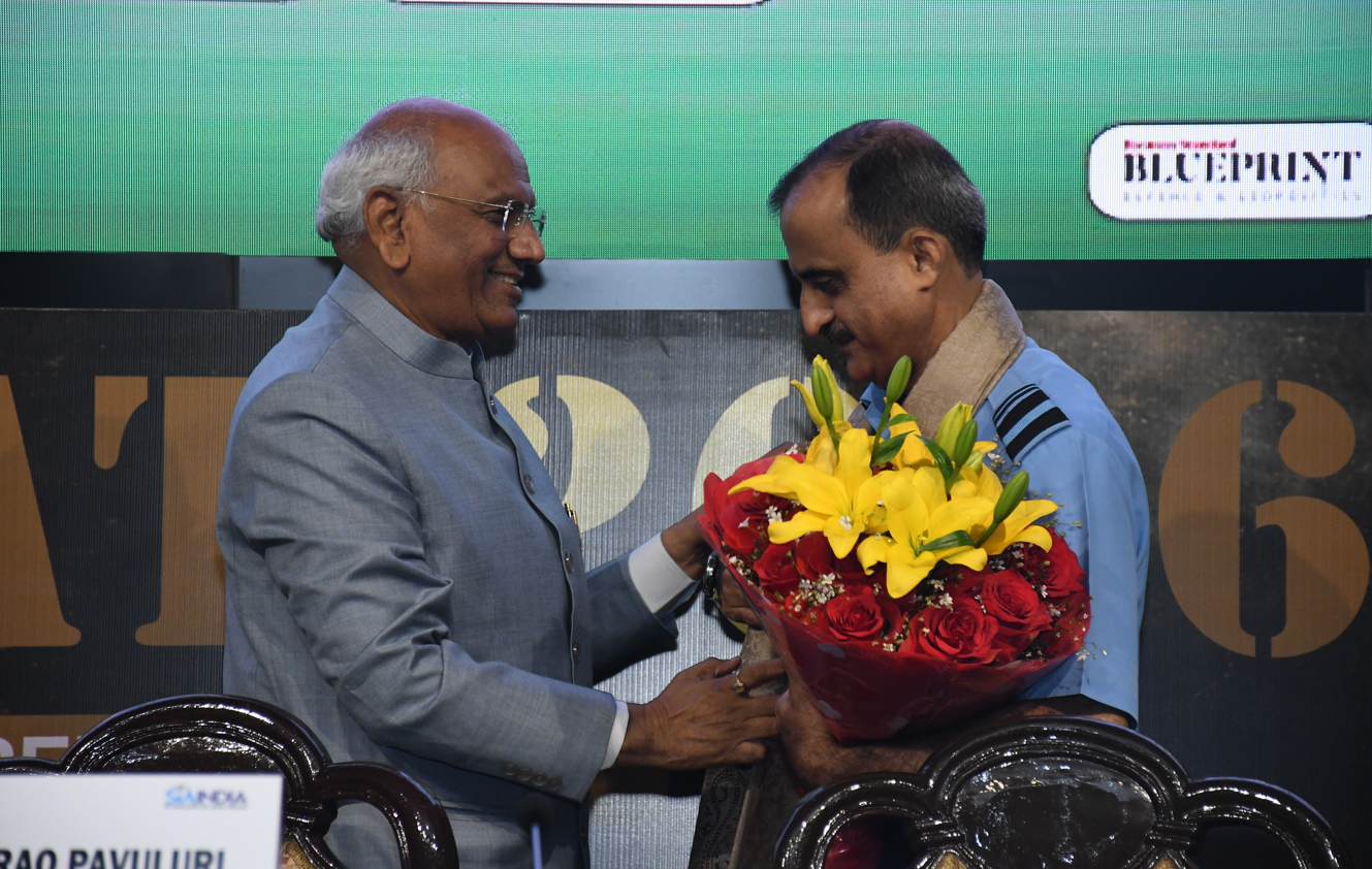 Chairman honoring AVM Manu Midha